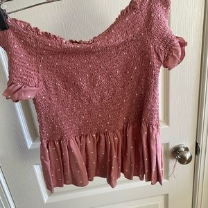 pink smocked shirt